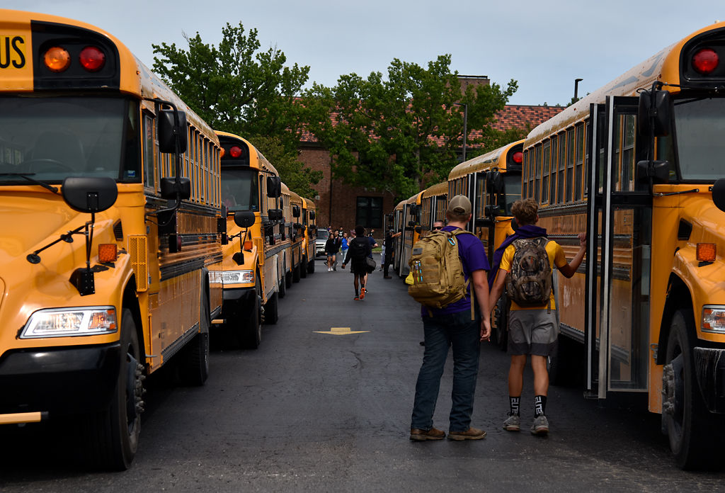 School buses wait outside Hickman High for students